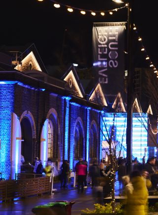 Attendees enjoying a night out at the South Eveleigh Solstice Festival, South Eveleigh