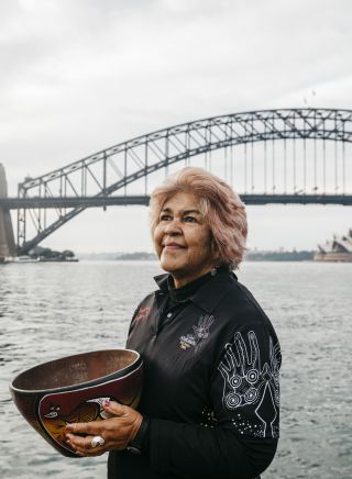 Margret Campbell performing a smoking ceremony at Blues Point Reserve, Blues Point in Sydney as part of the Dreamtime Southern X experience