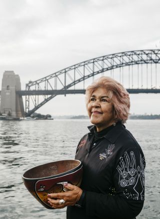 Margret Campbell performing a smoking ceremony at Blues Point Reserve, Blues Point in Sydney as part of the Dreamtime Southern X experience