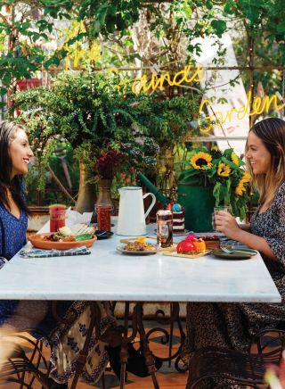 Friends enjoying breakfast at the The Grounds of Alexandria, Sydney