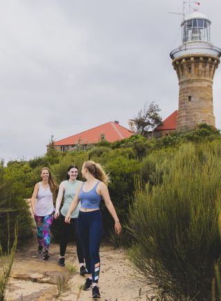 Friends enjoying a walk along the Barrenjoey Lighthouse walk, Palm Beach