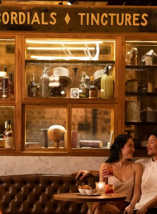 Couple enjoy drinks at Palmer and Co, Sydney