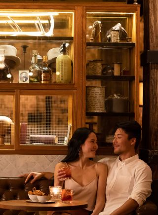 Couple enjoy drinks at Palmer and Co, Sydney 
