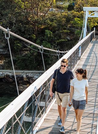 Couple enjoying a scenic walk around Parsley Bay, Vaucluse