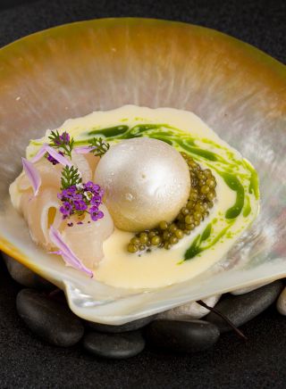 Koi Experiential’s Paspaley, with salted walnut gelato, Paspaley pearl meat, N25 Gold Oscietra caviar, creme fraiche and chive oil, Chippendale