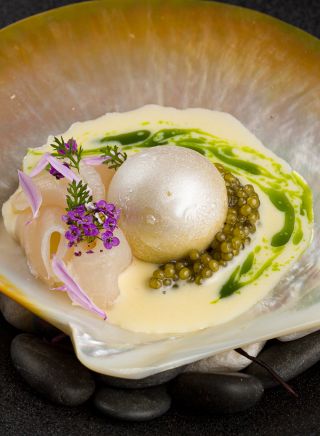 Koi Experiential’s Paspaley, with salted walnut gelato, Paspaley pearl meat, N25 Gold Oscietra caviar, creme fraiche and chive oil, Chippendale