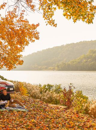 Couple enjoying a romantic picnic by Hawkesbury River, Wisemans Ferry