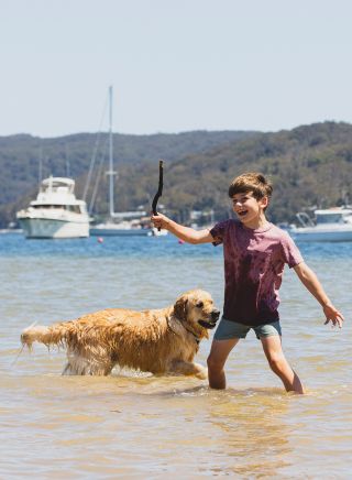 Boy playing with his best friend at Bayview Dog Park, Bayview