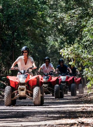 Friends enjoying a guided tour on quad bikes, Glenworth Valley