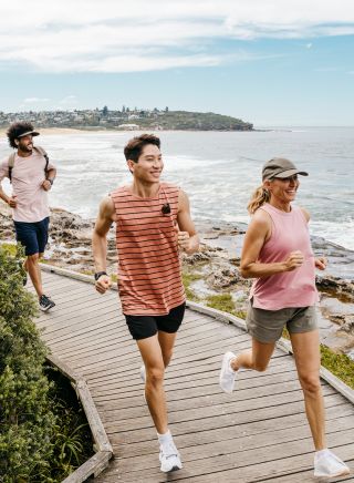 Friends enjoying coastal run, Freshwater Beach