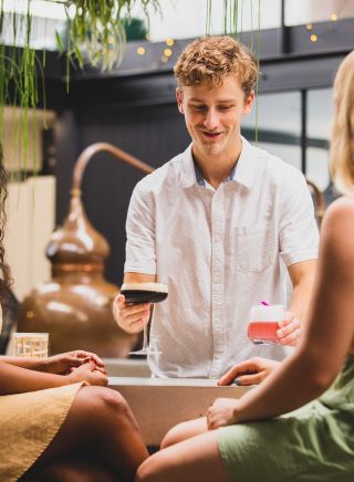 Friends enjoying cocktails, Seadrift Distillery, Brookvale