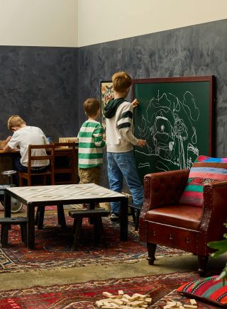 Kids drawing on board at Chuck & Son’s Brewing Co in St Peters