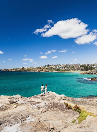 Couple overlooking coastal views from Tamarama to Coogee, Tamarama