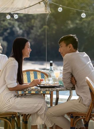 Couple enjoying food and drink with views of Balmoral Beach, Bathers Pavilion, Mosman