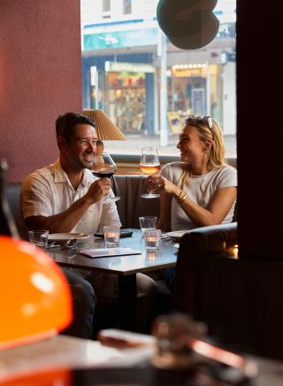 Couple drinking in the booth, Oxford House, Paddington - Credit: Steven Woodburn