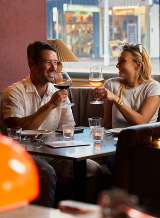 Couple drinking in the booth, Oxford House, Paddington - Credit: Steven Woodburn
