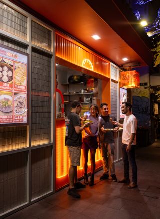 Friends enjoy delicious food during a Chinatown Street Tour, Local Sauce Tours, Haymarket