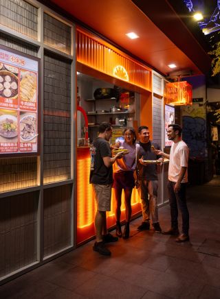 Friends enjoy delicious food during a Chinatown Street Tour, Local Sauce Tours, Haymarket