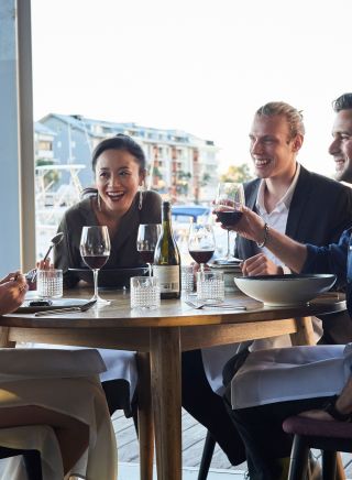 Friends enjoying food and drink waterside, LuMi Bar & Dining, Pyrmont 