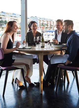 Friends enjoying food and drink waterside, LuMi Bar & Dining, Pyrmont 