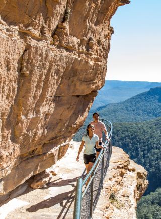 Couple enjoying a walk along the Wentworth Falls Track, Wentworth Falls Track, Blue Mountains National Park
