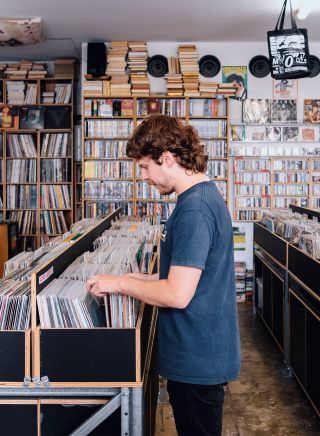 Man browsing through records, Repressed Records, Newtown