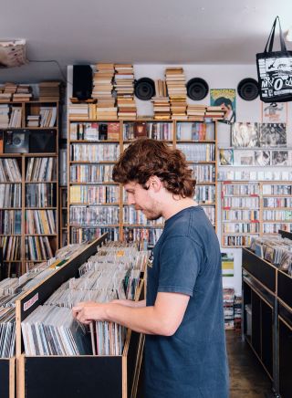 Man browsing through records, Repressed Records, Newtown