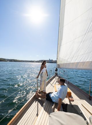A couple enjoys sailing in Sydney Harbour, Manly Sail, Manly