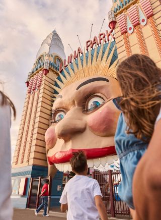 Family walking into the park, Luna Park Sydney, Milsons Point