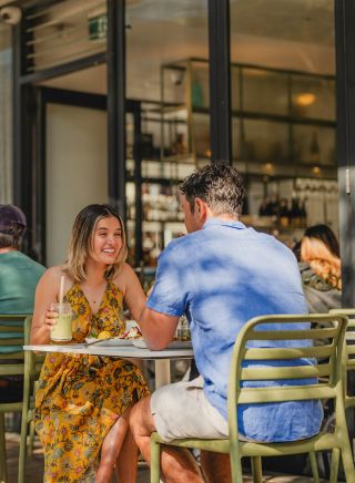 Friends drinking at outdoor cafe, Blackwood Cafe, Bondi 