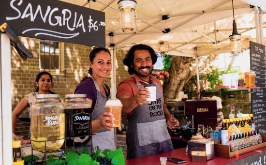 Streetscapes, The Rocks Stall owners with beverages at The Rocks Friday Foodie Market