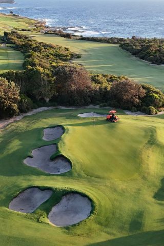 Aerial view of golf course green looking out to the ocean, Little Bay - Credit: St. Michael's Golf Club