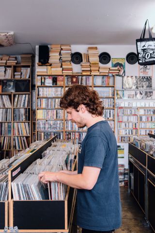 Man browsing through records, Repressed Records, Newtown