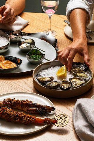 People eating and enjoying wine, AALIA, Sydney - Credit: AALIA