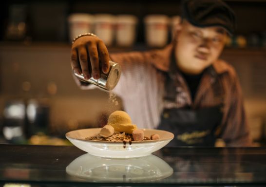 Chef preparing pancakes at Bay Vista restaurant in the eat street dining in Parramatta, Sydney West