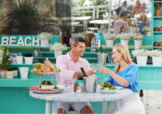 Couple enjoying a seafood lunch at the Beach Club in Watsons Bay Boutique Hotel 