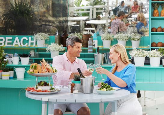 Couple enjoying a seafood lunch at the Beach Club in Watsons Bay Boutique Hotel 