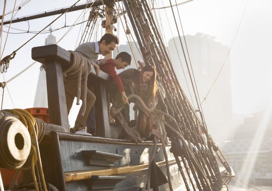 Family exploring the HMB Endeavour, an Australian-built replica of James Cook's ship on exhibit at the Australian National Maritime Museum, Darling Harbour