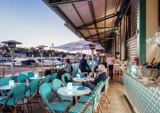 People sitting at Manta Restaurant near a marina, Woolloomooloo - Credit: Manta Restaurant
