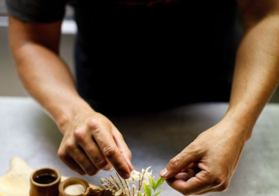 Chef preparing a dish at Toko Restaurant and Bar in Surry Hills