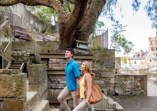 Couple exploring the historic back streets of The Rocks, Sydney.