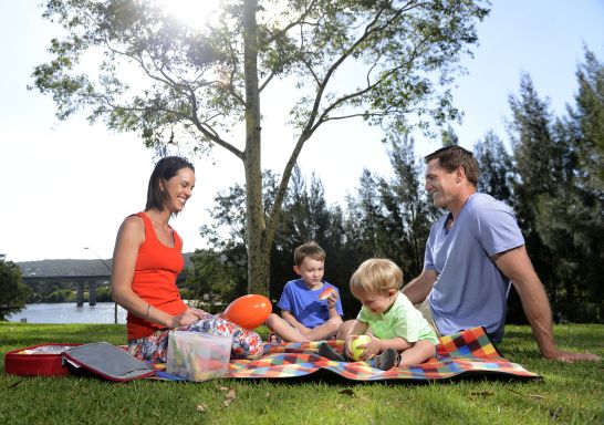 A family enjoys a picnic on the Nepean river, Penrith
