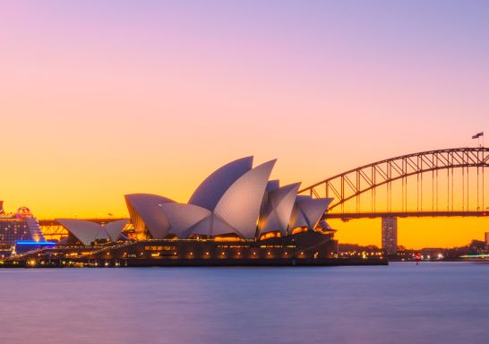 Sun setting over the Sydney Opera House and the Sydney Harbour Bridge, Sydney