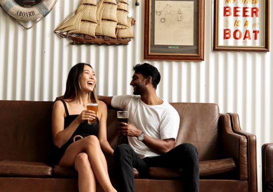 Couple enjoying beers at Willie The Boatman, St. Peters