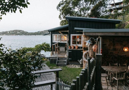 Outdoor view of the deck overlooking the water at The Little Black Shack, Great Mackeral 