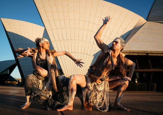 Three performers outside Opera House, Bangarra Dance Theatre, Sydney - Credit: Daniel Boud