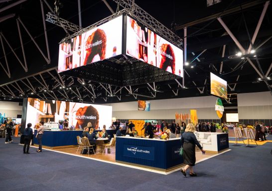 Stand in the ICC with people walking, Australian Tourism Exchange, Sydney