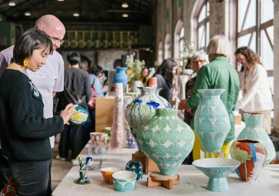Two people looking at ceramics at a stall, Sydney Ceramics Market, Eveleigh - Credit: Samee Lapham
